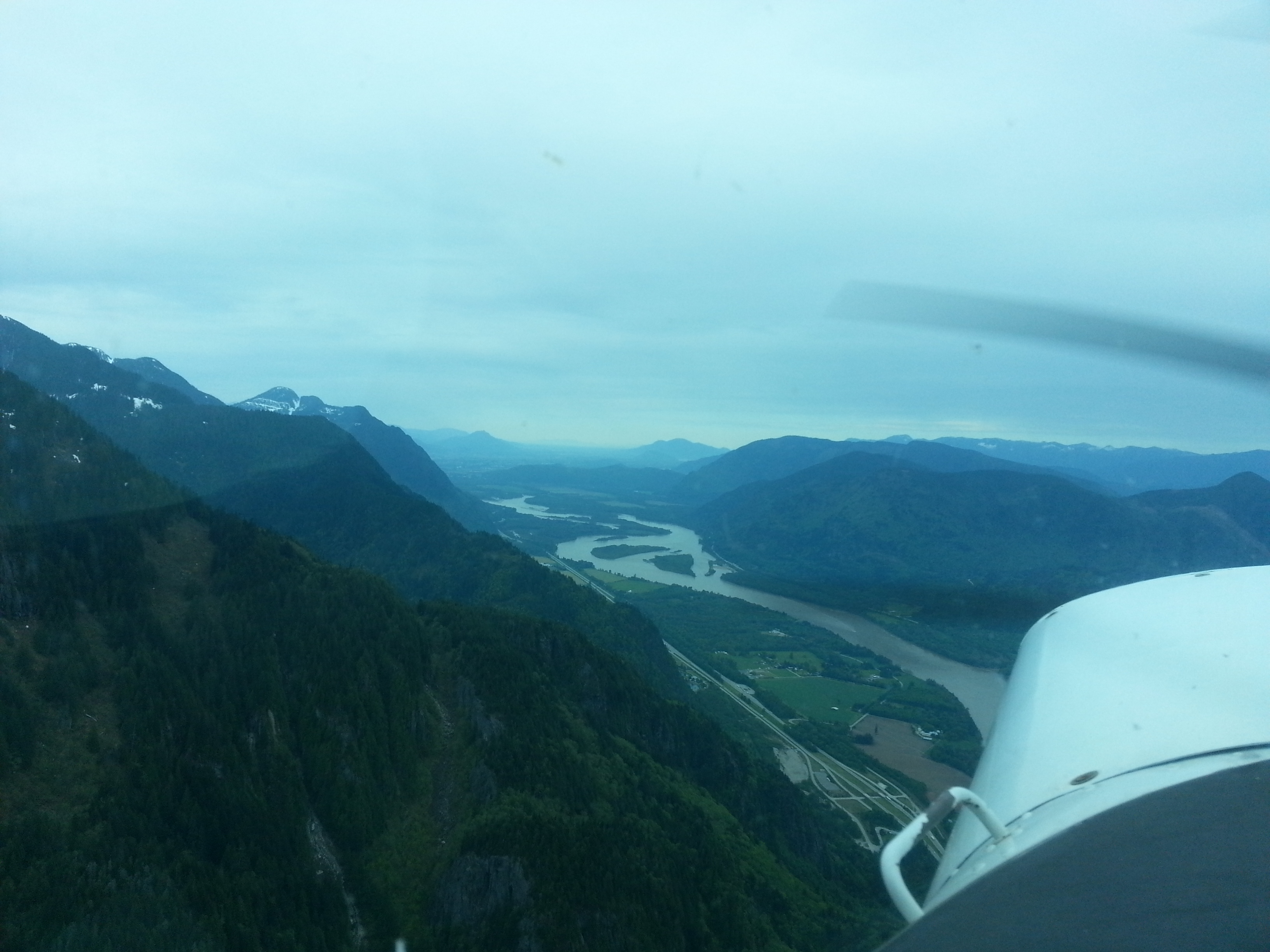 Over CYHE, facing back towards the lower mainland
