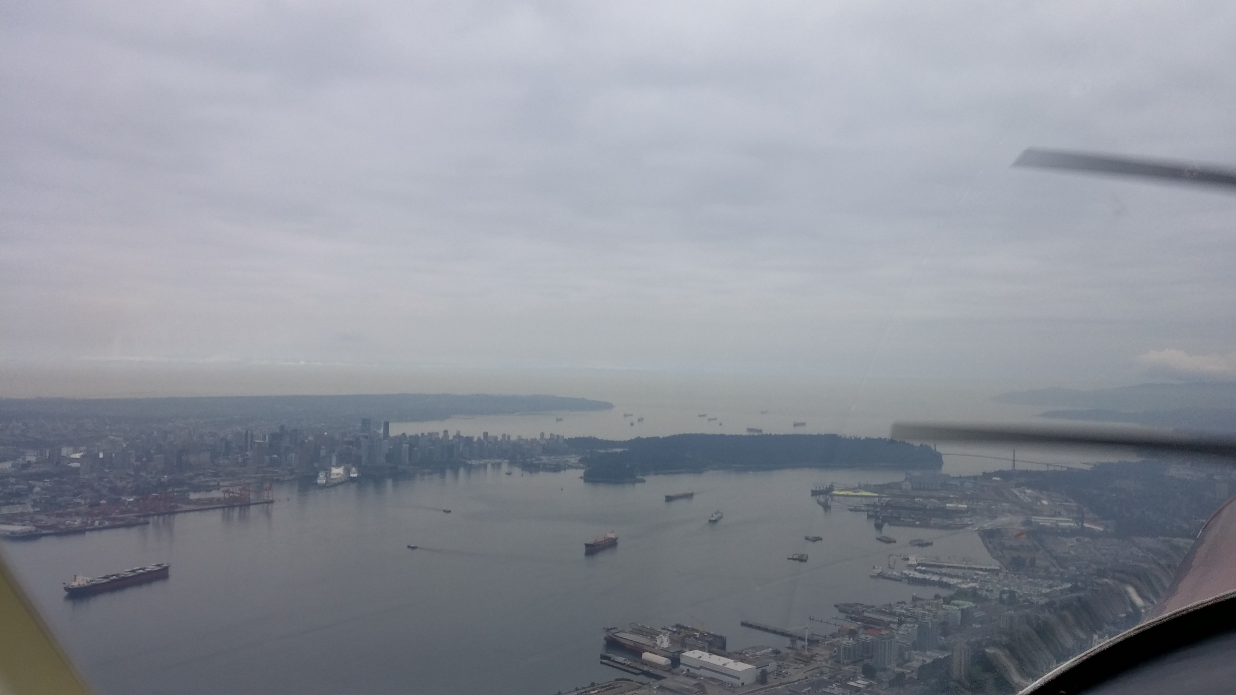 Approaching Stanley Park, flying along the North Shore