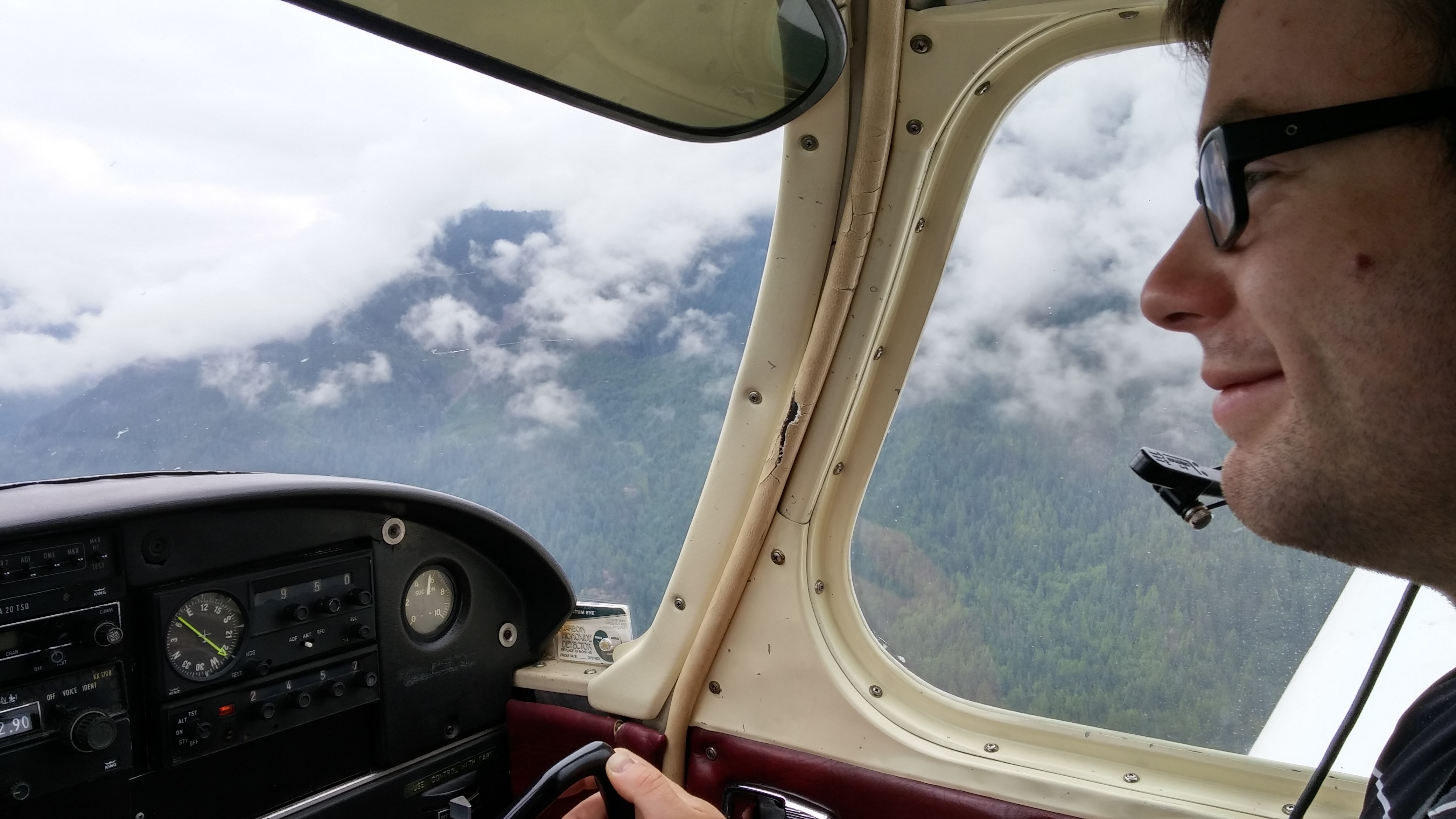 The face of a happy passenger enjoying some time at the controls