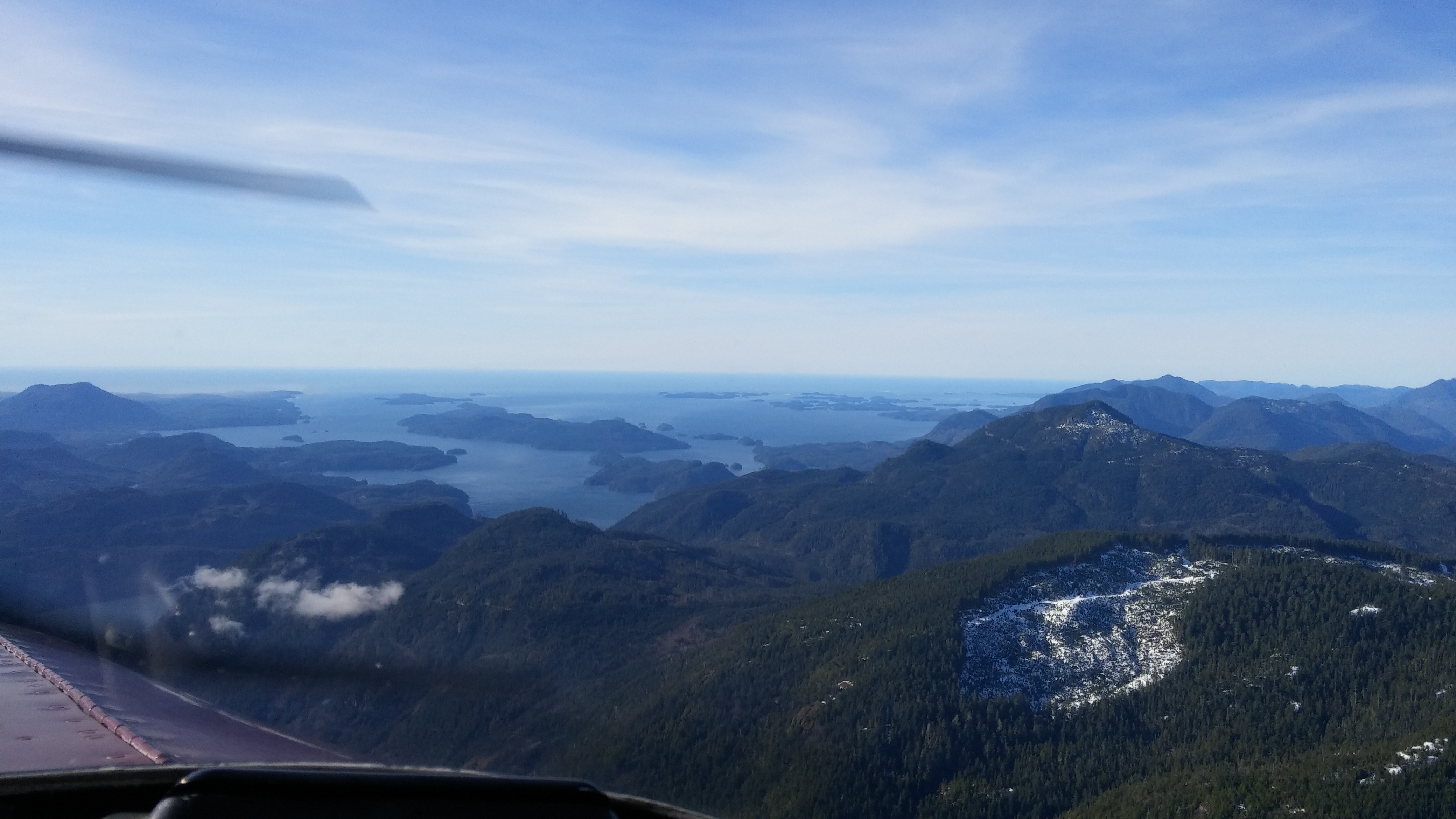 Exiting the Alberni Inlet, with Pacific Rim National Park visible in the distance